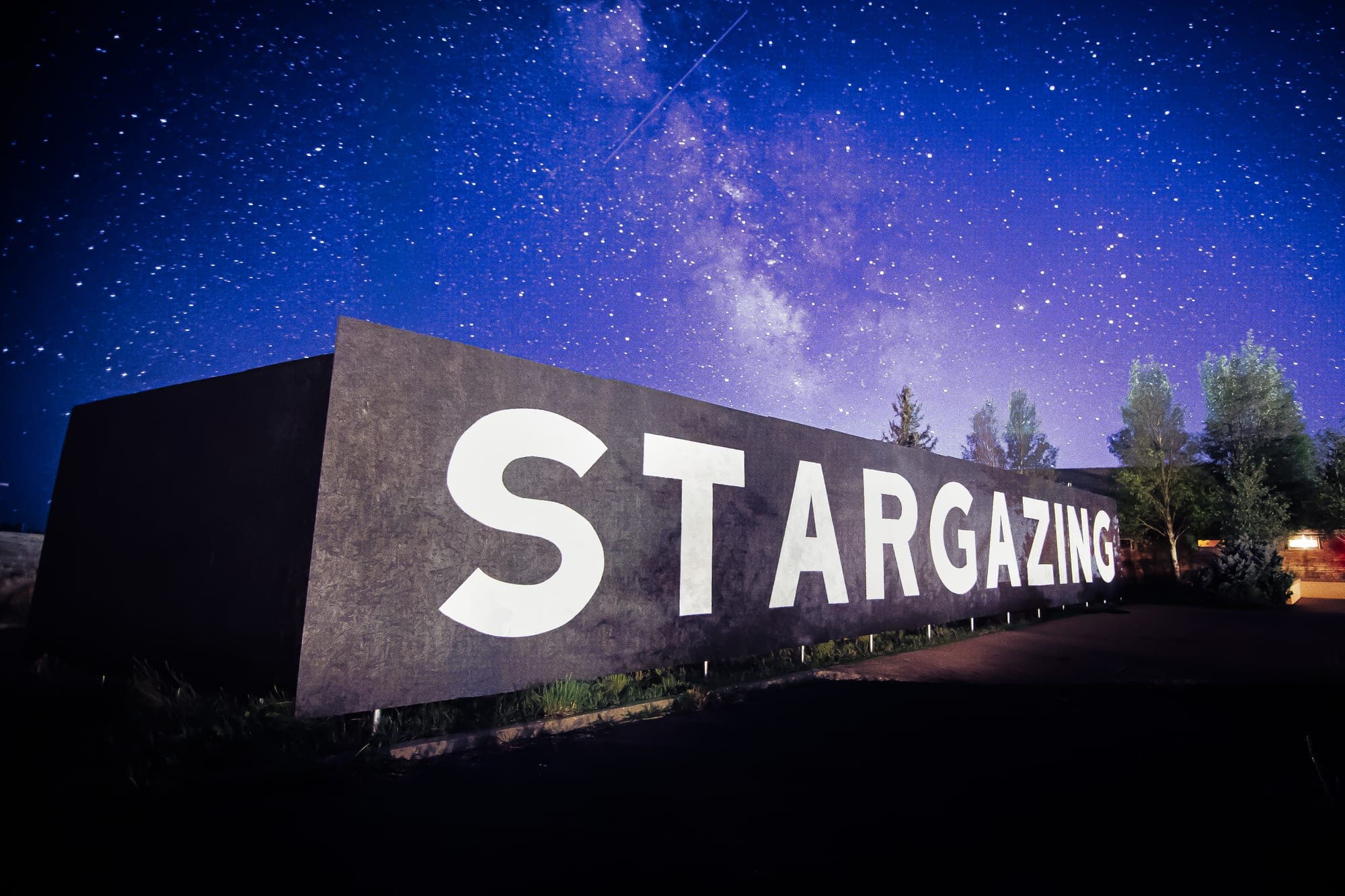 The Bryce Canyon Stargazing sign lit against the core of the Milky Way