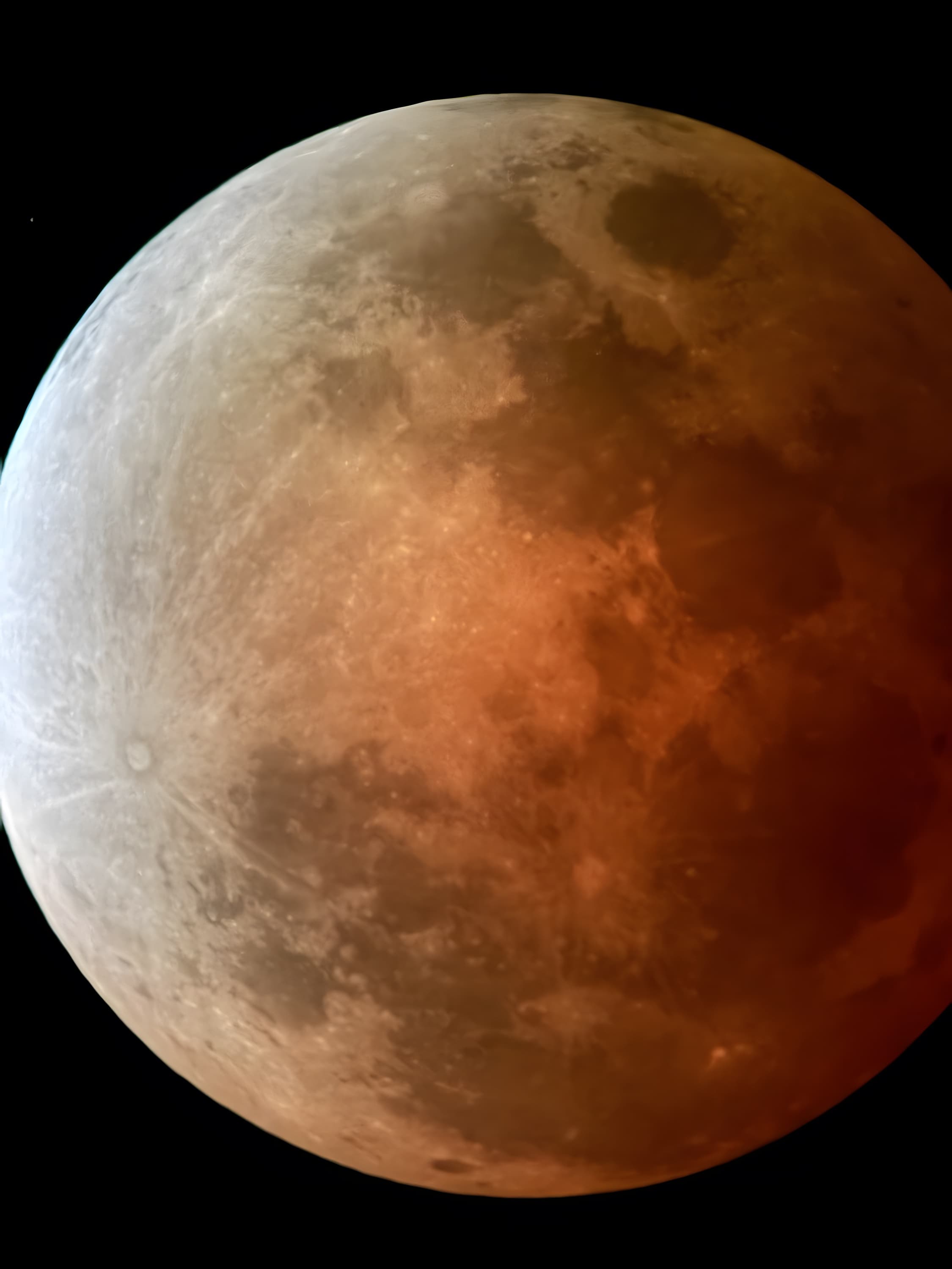 The blood moon — a partially eclipsed moon with a deep red hue