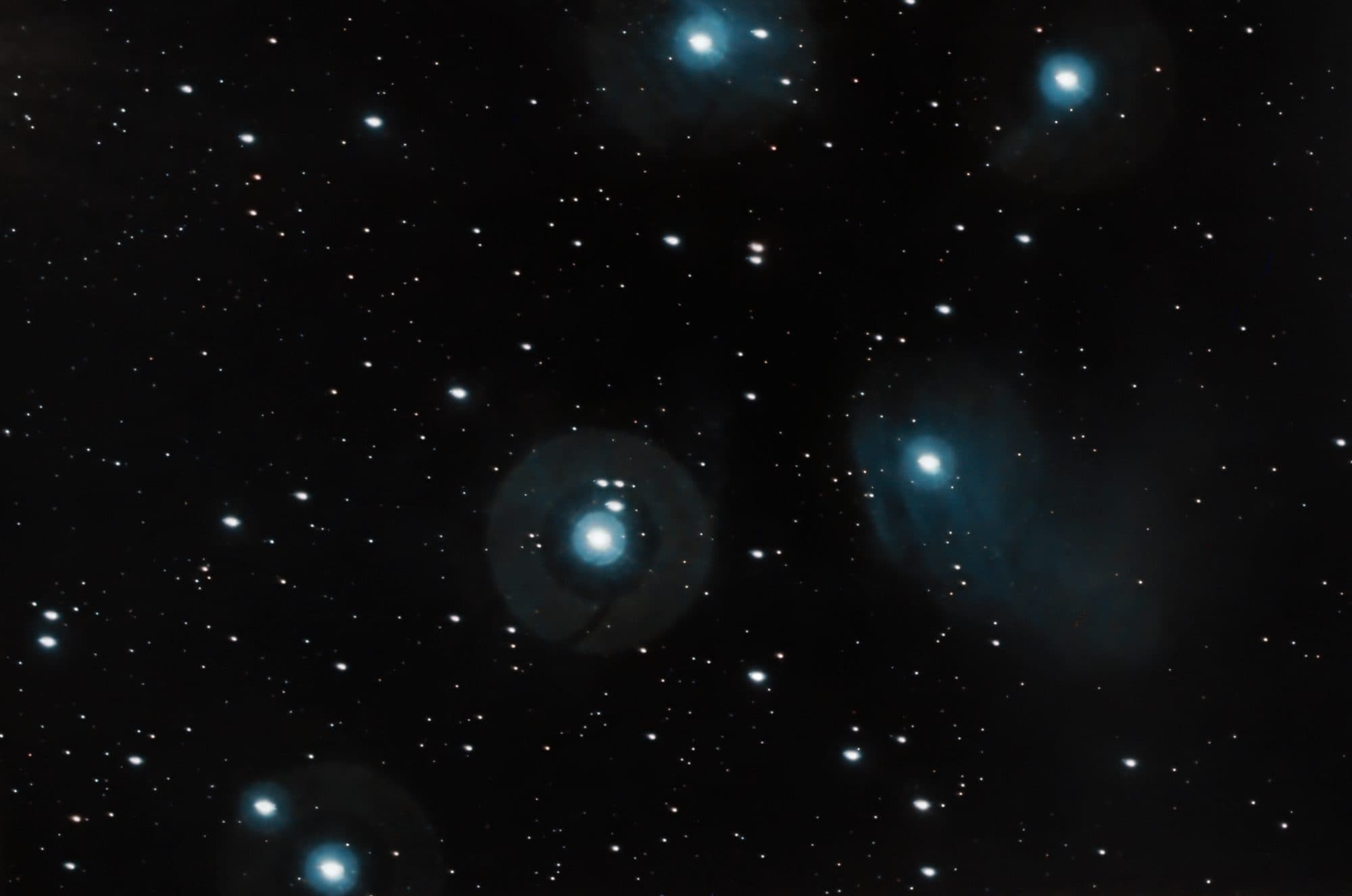 The Pleiades star cluster with its blue reflection nebulosity